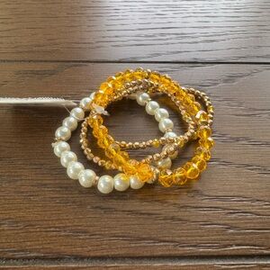 Gold and Pearl Beaded yellow Bracelets stack